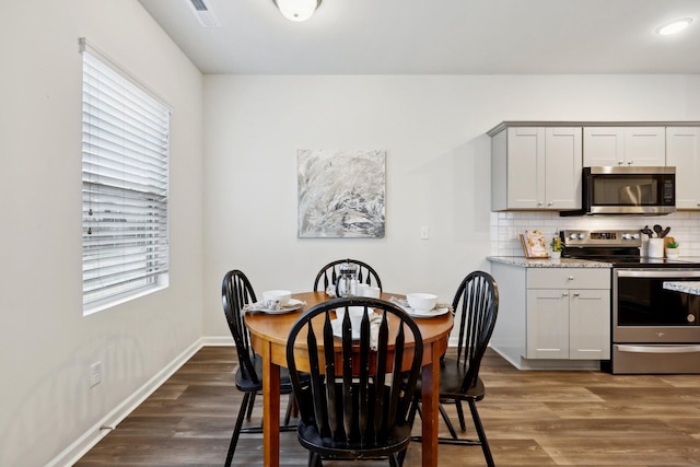 dining room featuring dark wood-type flooring