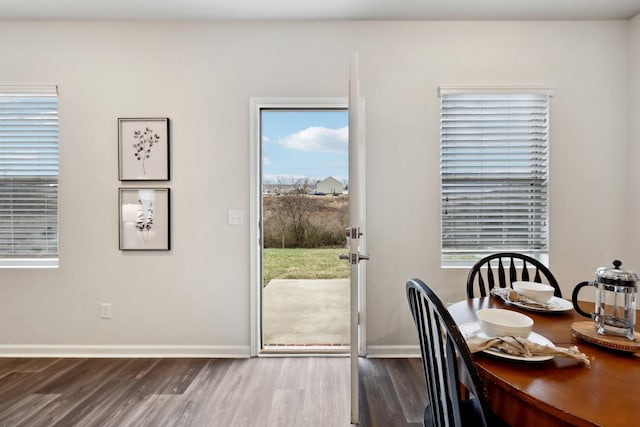 dining room with dark hardwood / wood-style floors