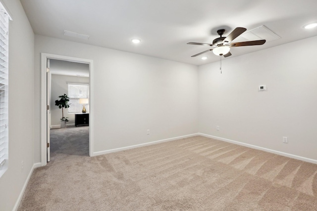 spare room with carpet flooring and ceiling fan