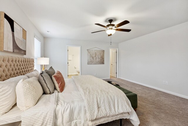 bedroom with ensuite bath, ceiling fan, and carpet