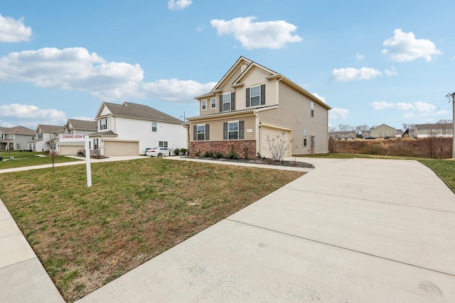 view of front of property with a garage and a front yard