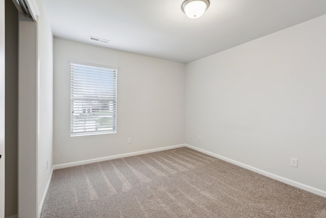 spare room featuring carpet flooring