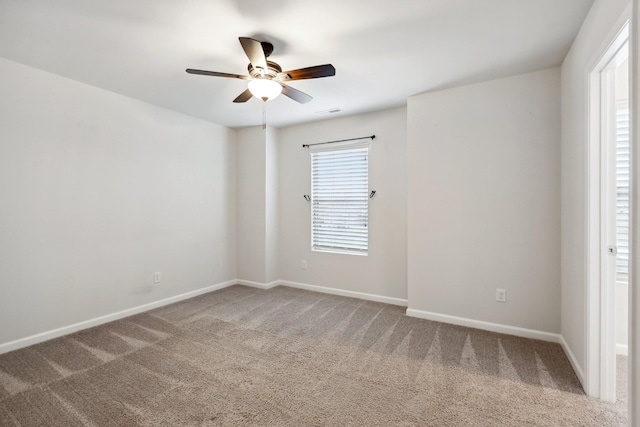 carpeted empty room with ceiling fan