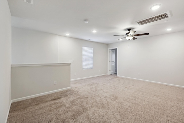 spare room with ceiling fan and carpet floors