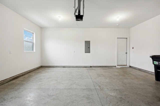 garage with electric panel and a garage door opener