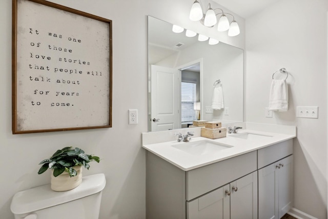 bathroom with vanity and toilet