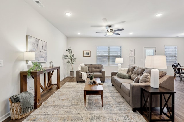 living room featuring ceiling fan and wood-type flooring