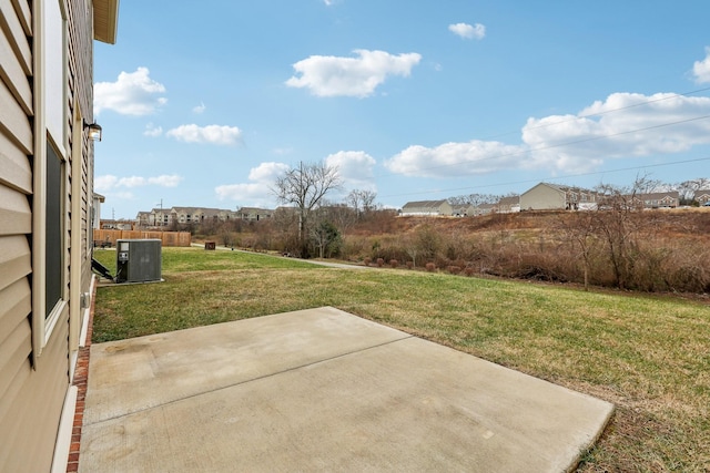 view of yard featuring central AC unit and a patio