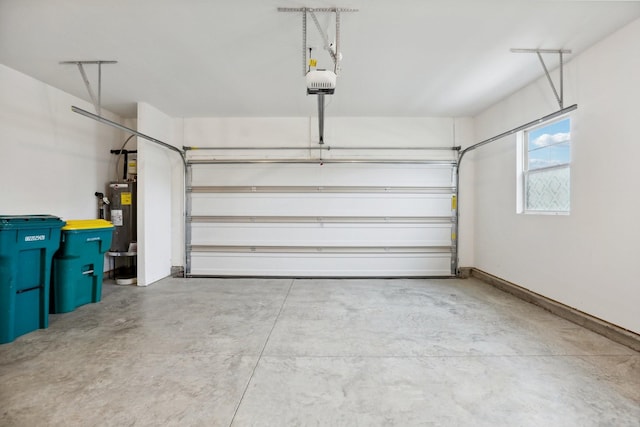 garage featuring electric water heater and a garage door opener