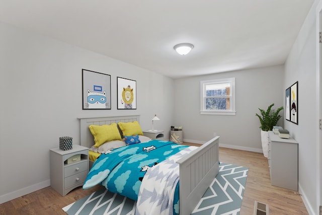 bedroom with light hardwood / wood-style flooring