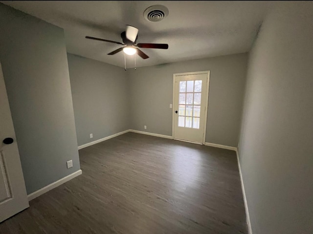 unfurnished room featuring dark hardwood / wood-style flooring and ceiling fan