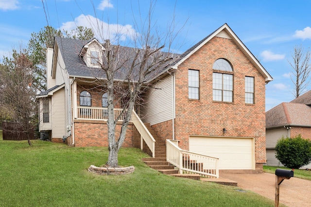 view of property featuring a front yard and a garage