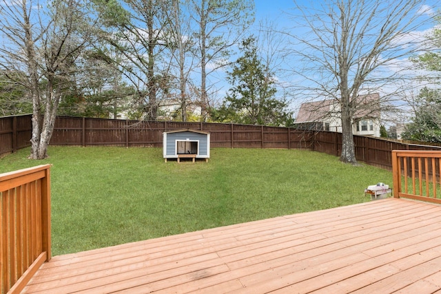 wooden deck with a lawn