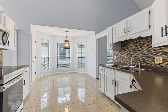 kitchen featuring backsplash, sink, white cabinets, and stainless steel appliances