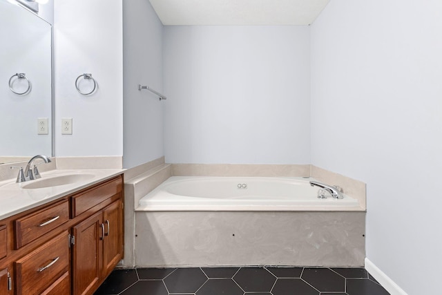 bathroom featuring tile patterned flooring, vanity, and a bathtub