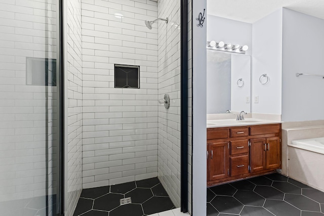 bathroom with tile patterned flooring, vanity, and a shower with door