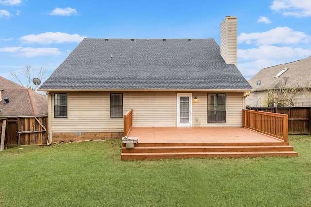 rear view of property with a lawn and a wooden deck