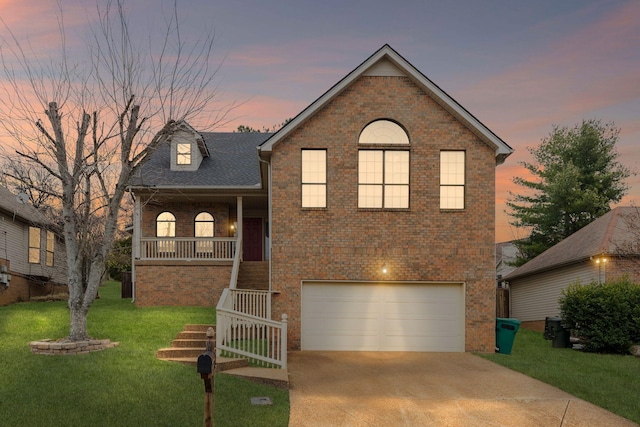 view of front of house with a lawn and a garage