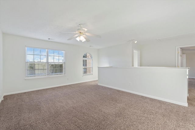 empty room featuring carpet and ceiling fan