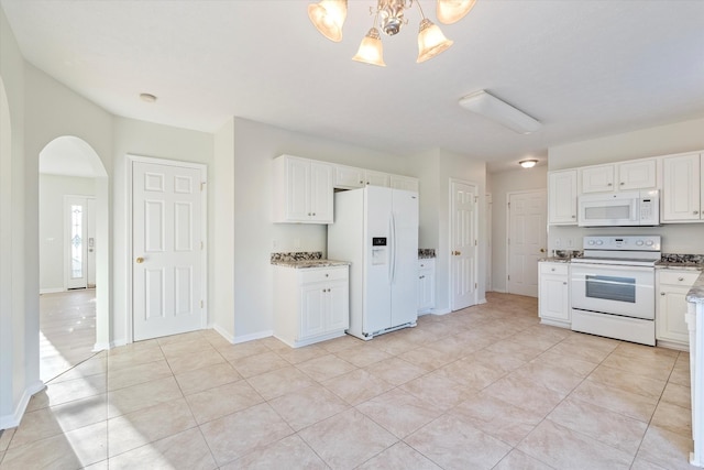 kitchen featuring pendant lighting, white appliances, light tile patterned floors, a notable chandelier, and white cabinetry