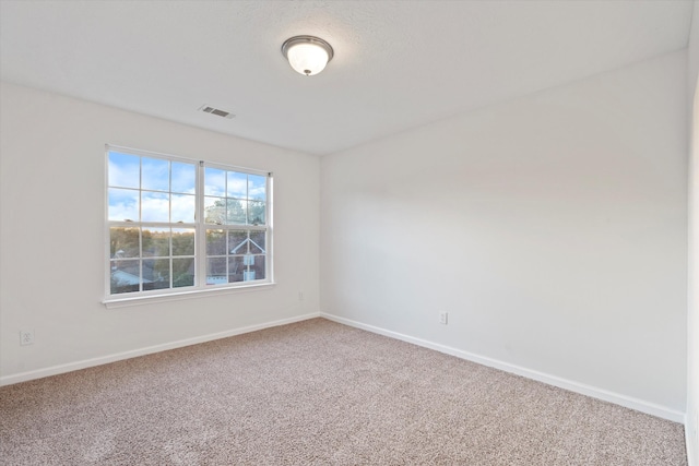 spare room featuring carpet flooring