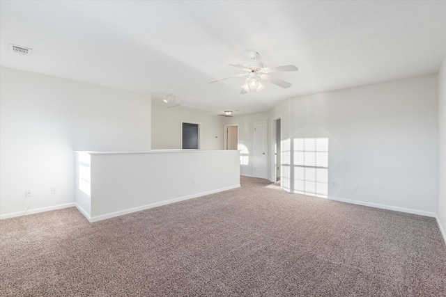 carpeted empty room with ceiling fan