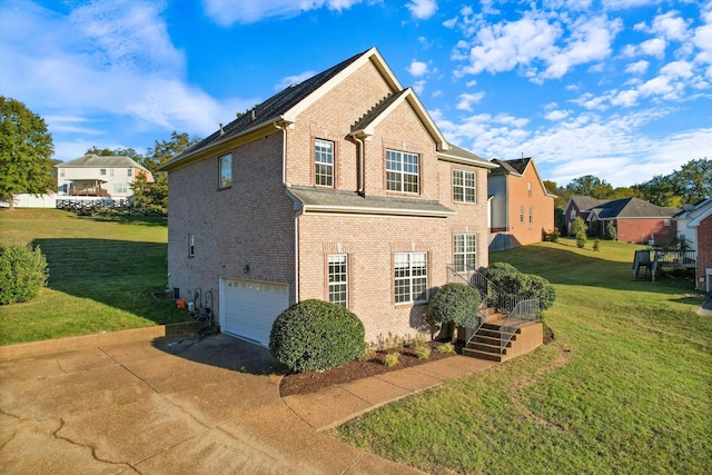 view of home's exterior featuring a yard and a garage