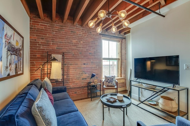 living room with beamed ceiling and brick wall