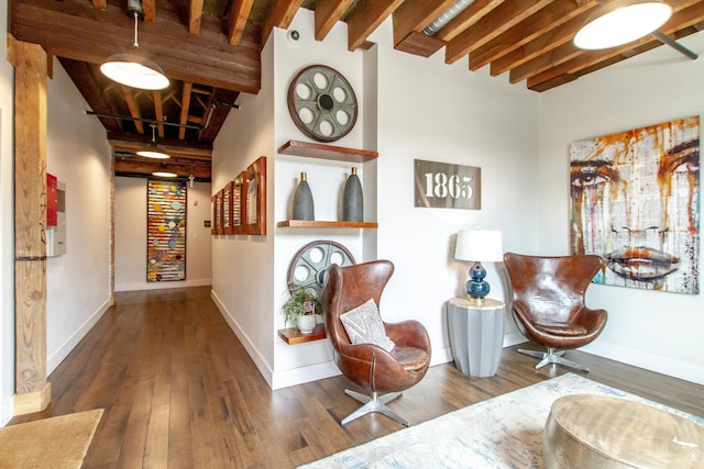 corridor with beam ceiling and dark hardwood / wood-style flooring