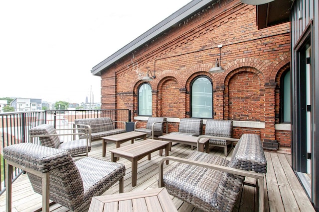 wooden terrace with outdoor lounge area