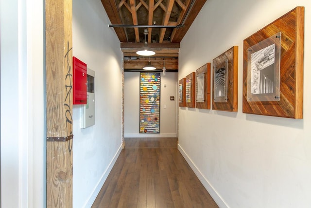 hall featuring hardwood / wood-style floors and a towering ceiling