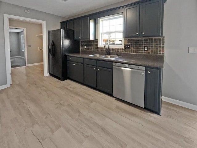 kitchen with sink, stainless steel dishwasher, backsplash, black fridge with ice dispenser, and light wood-type flooring