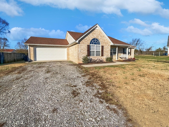 single story home featuring a front yard and a garage