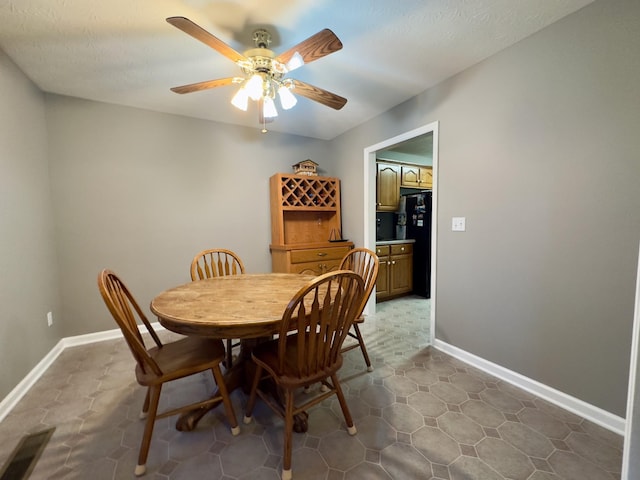 dining area with ceiling fan