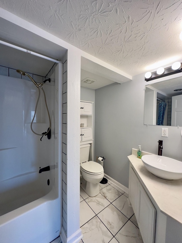 full bathroom featuring toilet, vanity, a textured ceiling, and shower / tub combo with curtain