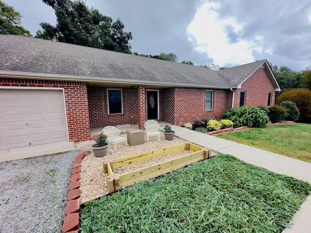 single story home with a front lawn and a garage