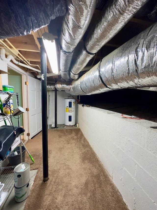 basement featuring carpet flooring and water heater