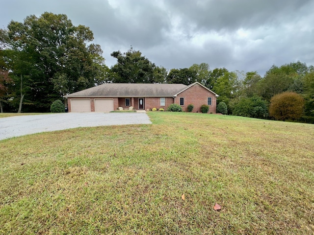 single story home with a garage and a front lawn