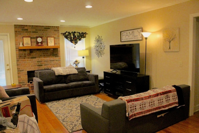 living room with hardwood / wood-style floors and ornamental molding