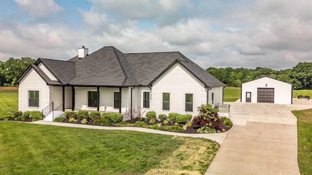 view of front of house with a garage, a porch, an outdoor structure, and a front lawn