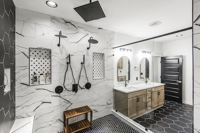 bathroom with walk in shower and vanity