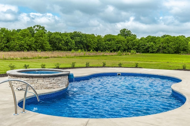 view of pool with an in ground hot tub and a lawn