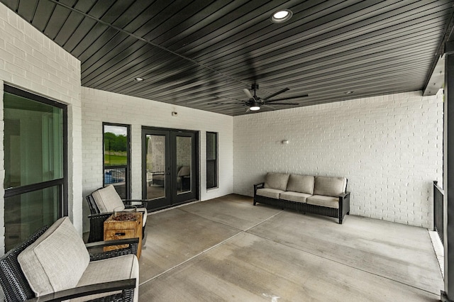 view of patio with french doors, ceiling fan, and an outdoor living space