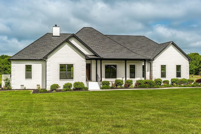 view of front of property with a front lawn