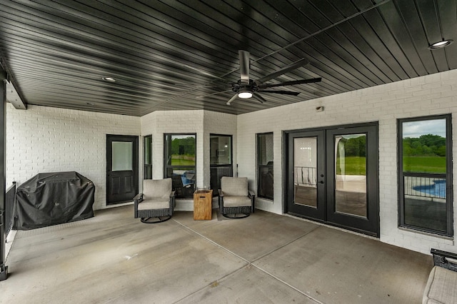 view of patio / terrace with ceiling fan and grilling area