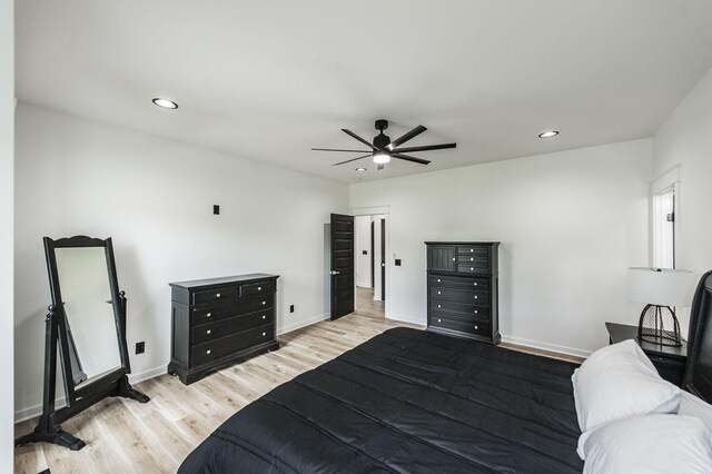 bedroom with ceiling fan and light wood-type flooring