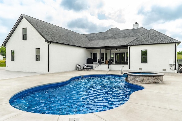 view of pool featuring a patio area, ceiling fan, and an in ground hot tub