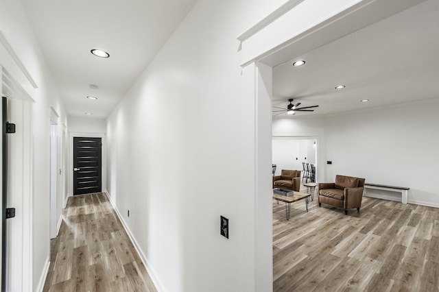 corridor featuring light hardwood / wood-style floors