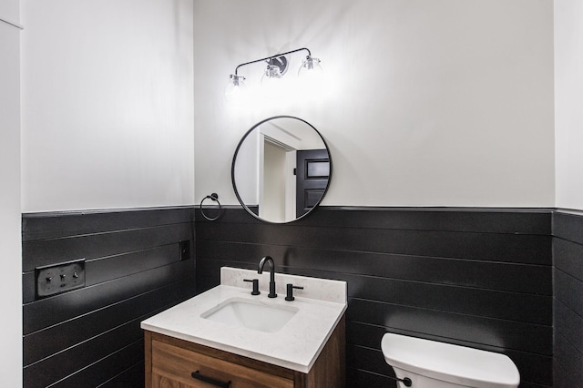 bathroom featuring toilet and vanity