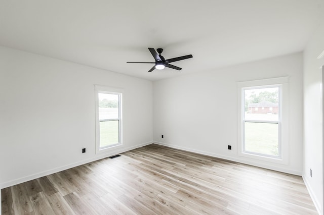 empty room featuring ceiling fan and light wood-type flooring